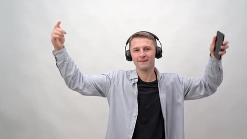 Man Dancing with Headphones and Cell Phone