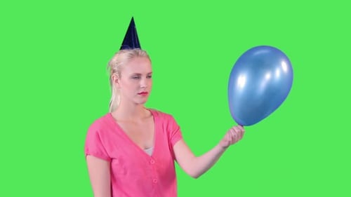Woman Pops Balloon on Green Screen Background