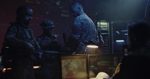Soldiers Working at Computers in Dark War Room