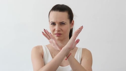 Woman with Arms Crossed Saying No