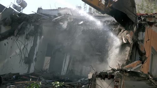 Building Demolition with Excavator in an Urban Area