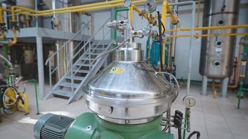Large Light Workshop with Metal Containers and a Complex Piping System