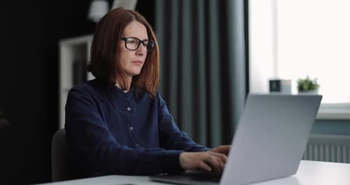 Woman Using Laptop for Work