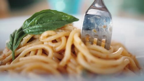 Close Up of Pasta Being Twirled on Fork