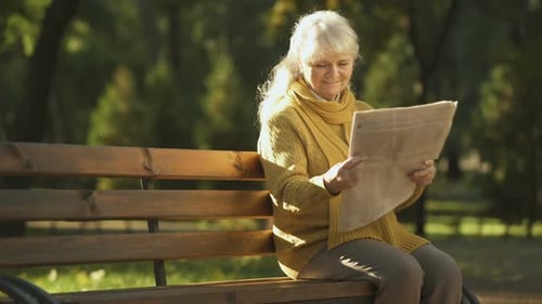 Happy Old Woman Reading Newspaper