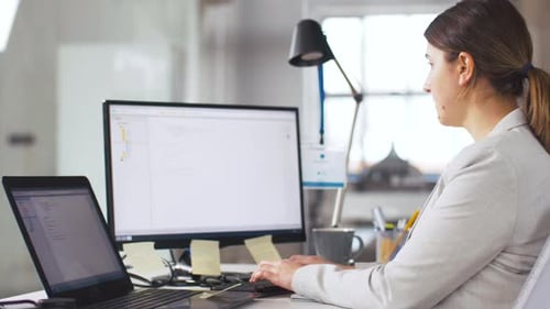 Female Programmer with Computer Working at Office 6
