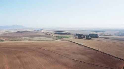 Drone Shot of Farming Lands and Mountain Silhouette By the Countryside