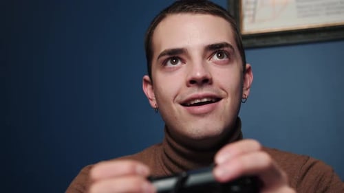 Young Adult Playing Video Game with Controller