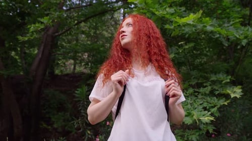 Woman in the Forest Looks Around