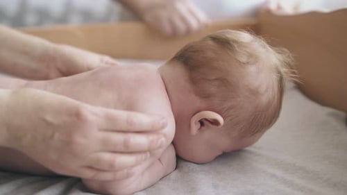 Loving Massage for Tiny Infant on Changing Table
