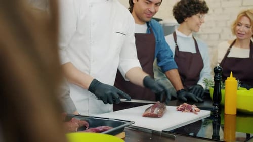 Chef Teaches Students to Cut Meat in Cooking Class