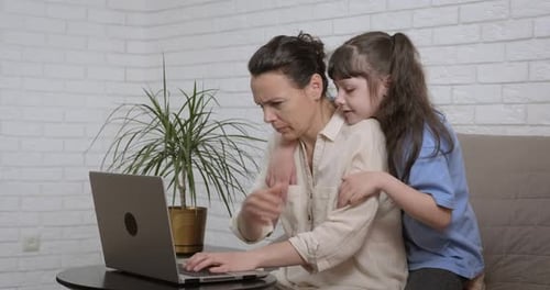 Remote mother work with child.