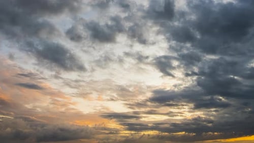 Beautiful Orange Sunset Sky with Dark Grey Clouds