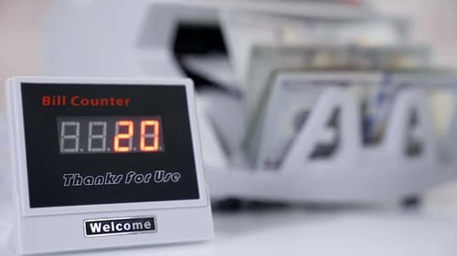 US dollar banknote in counting machine. Automatic mechanism for bank financial operations.