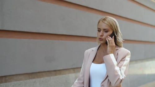 Closeup Girl Speaking on Phone at Street. Woman Talking Phone in Suit Outdoor