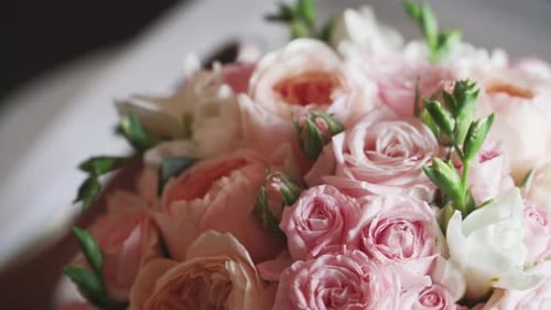 Close-up. Wedding bouquet of flowers from pink and white. Slow motion