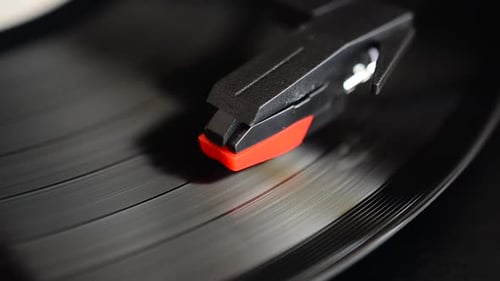 Record Needle on Spinning Vinyl Record Close-Up