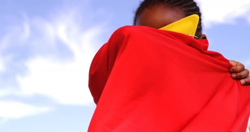 Young Child Dressed as a Superhero with Cape