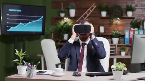Man Uses Virtual Reality Headset in Office