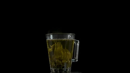 Hot tea in a glass cup.