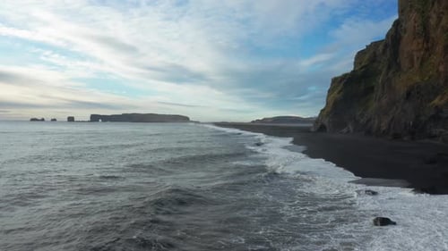 Drone Over Sea And Black Sand Beach