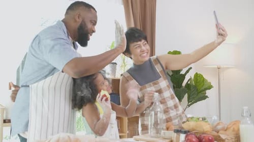 Joyful Family Cooking Together in Bright Kitchen