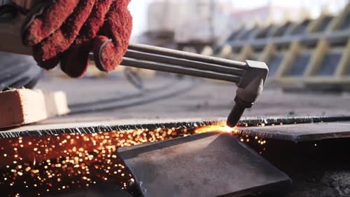 gas cutting of metal, sparks fly
