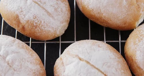 Dough balls with icing sugar on baking tray 4k