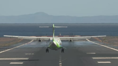 Jetliner Arrival. Airplane Landing on Runway By the Sea