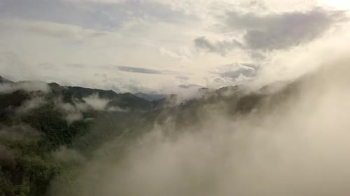 Aerial View Flying Thru Cloud Covered Mountain 07