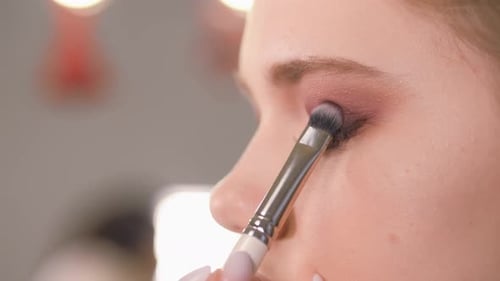 Applying Eye Shadow with Brush, Close Up View