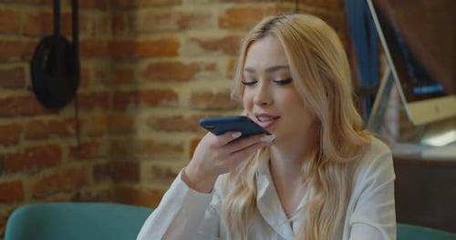 Girl Using Smart Phone Voice Recognition Dictates Thoughts Voice Dialing Message in Cafe Audio Ai