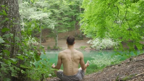 Meditating by the lake.