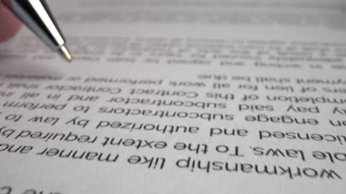 Businessman sign signature on document contract paper at office desk