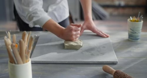 Potter Kneads a Piece of Clay to Make Pottery at the Workshop Ceramist at Work Craftsmanship of
