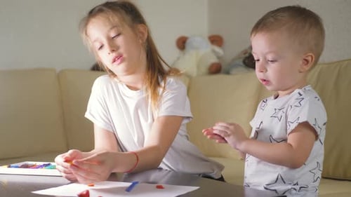Children Play with Plasticine at Home