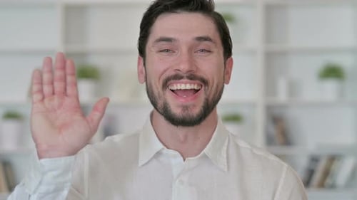 Man Waving Hand To Say Hello