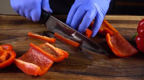 Slicing Red Bell Pepper on Cutting Board