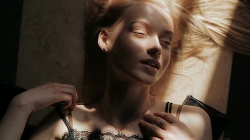 Beautiful Blonde Woman Posing Lying Down