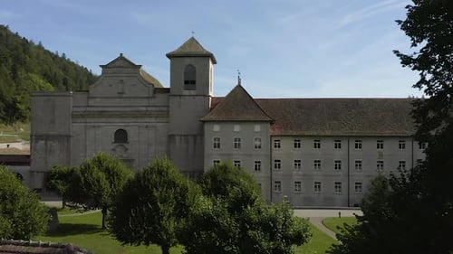 Abbey surrounded by trees on a beautiful sunny summer day. Drone DJI Mavic