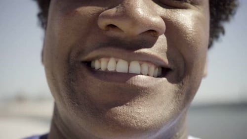 Close Up of Smiling Young Adult Face