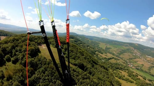 Flying Adrenaline Adventure Paragliding above Green Country in Sunny Summer