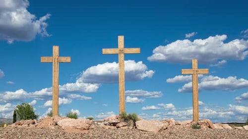 Three Wooden Crosses Under a Blue Sky