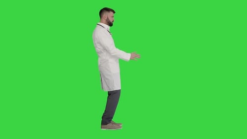 Arab Doctor Dancing and Having Fun on a Green Screen, Chroma Key.