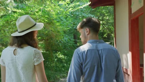 Rear view of a young couple walking