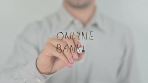Man Writes Online Banking on Glass