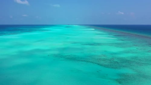 Aerial top down abstract of luxury resort beach vacation by blue water with clean sand background of