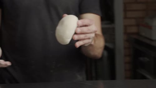 Baker Preparing Dough With Flour Flying Around