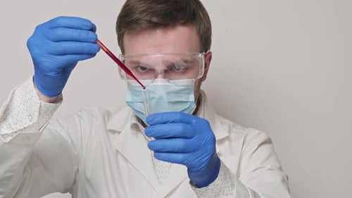 Lab Technician Holding Pipette and Testing Blood Samples. Close-up in , UHD