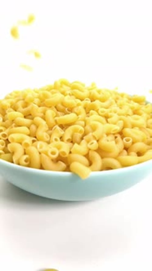 Macaroni of Hard Varieties Fall Into a Blue Dish, Slow-motion, Close-up
